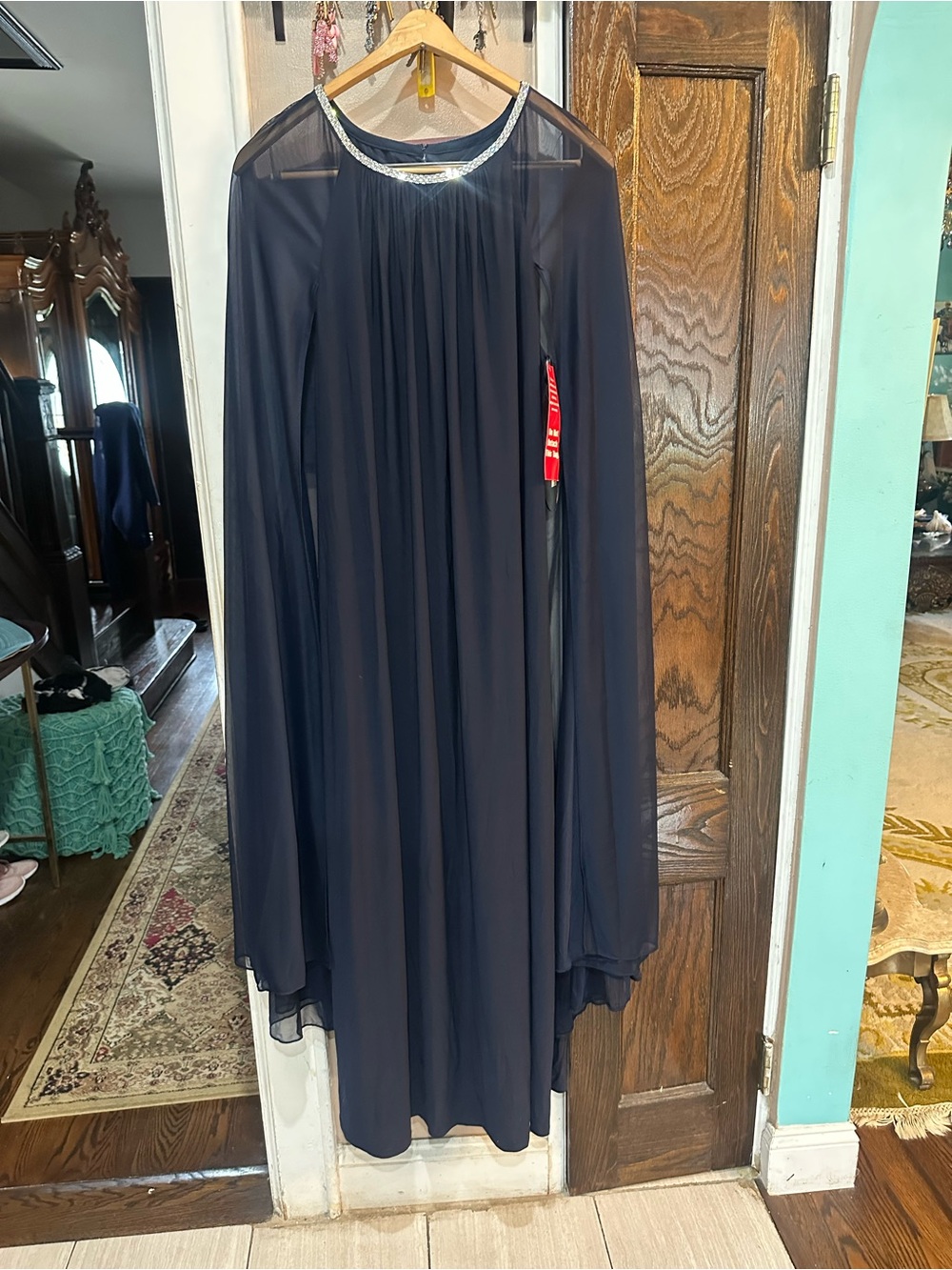 R&M Richards Navy Sheer Formal Cape Gown with a Jeweled Embellished Neckline